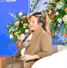 Laura Correnti, founder and CEO of Deep Blue Sports + Entertainment, speaking on stage at Marie Claire&rsquo;s Power Play summit in Philadelphia.